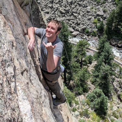 Teddy rock climbing outdoors