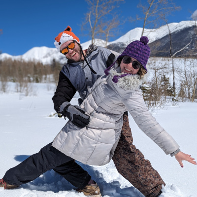 Teddy and his partner Tristine doing a swing dance dip in the snow